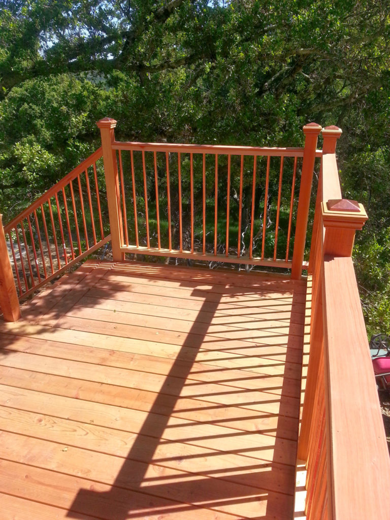 Wooden railings of a second-floor deck patio